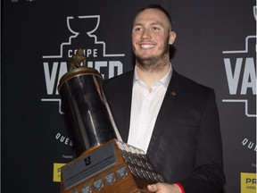 Laval University Rouge et Or's Mathieu Betts receives the J.P. Metras trophy as outstanding down lineman, at the U SPORTS football gala as part of the Vanier Cup weekend, in Quebec City, Thursday, Nov. 22, 2018.