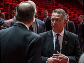 General Manager of the Detroit Red Wings Ken Holland talks to the Lindsay family during the public visitation of NHL Hall of Famer and former Detroit Red Wing Ted Lindsay at Little Caesars Arena home of the Detroit Red Wings on March 8, 2019 in Detroit, Michigan.