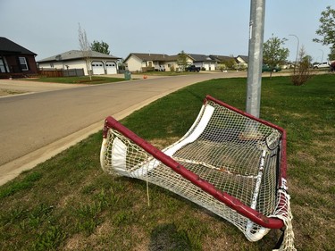 Over-turned net along an empty street in High Level where about 4000 residents were evacuated from the Chuckegg Creek fire that is still approximately three kilometres from the town site, May 22, 2019.