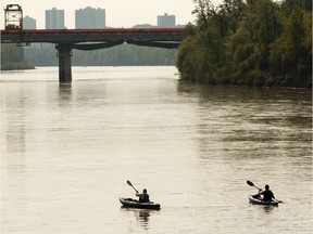 Kayakers ply the waters of the North Saskatchewan River east of the Groat Road Bridge on a warm day in Edmonton, on Monday, May 27, 2019.
