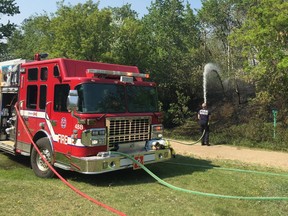 Firefighters battle a brush fire in Mill Creek Ravine Tuesday, May 28, 2019.