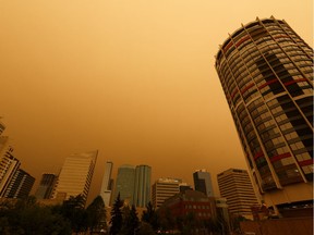 Wildfire smoke is seen in the air in downtown near Edmonton House as an Environment Canada air quality warning is issued in Edmonton on May 30, 2019.