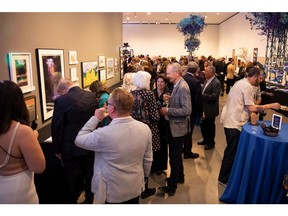 People mingle during Art on the Block at the Art Gallery of Alberta on Friday, May 24.