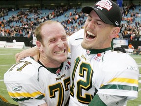 Edmonton Eskimos A.J. Gass, left, and Jason Maas celebrate after defeating the B.C. Lions in the CFL Western Final at B.C. Place in Vancouver, B.C., on Nov. 20, 2005.