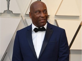In this file photo taken on February 24, 2019, director John Singleton arrives for the 91st Annual Academy Awards at the Dolby Theatre in Hollywood, California. - Johnn Singleton, director of the iconic 1991 movie "Boyz n the Hood," died Monday, April 29, 2019 at the age of 51 after suffering a stroke, his family said in a statement to US media. "Boyz n the Hood" -- which described the gang-ridden neighborhood of Singleton's childhood and which he directed aged 22 -- won him an Oscar nod as best director, the first African American to achieve the distinction.