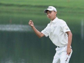 Fourteen year-old Kuang Yang of China reacts after a putt during the second round of the China Open golf tournament in Shenzhen, in China's southern Guangdong province on May 3, 2019. (STR/AFP/Getty Images)