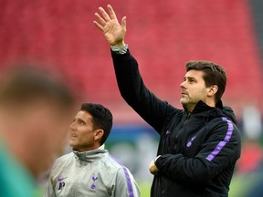 Tottenham Hotspur's Argentinian head coach Mauricio Pochettino (R) gestures during a training session on May 7, 2019, in Amsterdam, on the eve of the UEFA Champions League semi-final second leg football match between Ajax Amsterdam and Tottenham Hotspur.