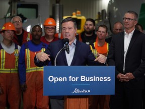 Alberta Premier Jason Kenney (middle) and Alberta Finance Minister Travis Toews (right) announced at Lafarge Infrastructure in Edmonton on Monday May 13, 2019 that their government plans to create jobs in the province by having the lowest corporate business tax rate in Canada. (PHOTO BY LARRY WONG/POSTMEDIA)