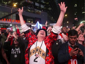 Toronto Raptors fans celebrate in the closing seconds of the team's 100-94 win over the Milwaukee Bucks to take the NBA Eastern Conference Championship, in Toronto on Saturday, May 25, 2019. The Raptors go to the NBA final for the first time in the franchise's history.