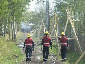 Structural firefighters from 22 Alberta cities, towns and counties are protecting homes and commercial buildings in communities threatened by the Chuckegg Creek Fire.