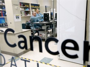 Nanostics Chief Science Officer Desmond Pink and medical lab technologist Leanne Stifanyk pose for a photo inside Nanostics laboratory space within DynaLIFE headquarters, 10150 102 St., in Edmonton Friday May 24, 2019. Nanostics is using artificial intelligence in an improved screening test for prostate cancer.