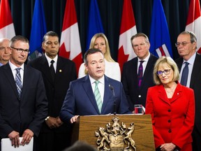 Finance Minister Travis Toews and Premier Jason Kenney address the provinces financial situation along with  Janice MacKinnon, a former Saskatchewan finance minister, and chair of a blue-ribbon panel announced on Tuesday, May 7, 2019, in Edmonton .