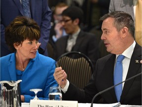 Premier Jason Kenney talks with newly appointed Alberta Energy Minister Sonya Savage before speaking at the tanker ban hearings known as Bill C-48, in Edmonton, April 30, 2019.