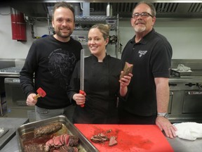 Restaurateur Michael Maxxis, left, chef Lindsay Porter of London Local and Mustard Seed volunteer Robin Brownlee at the Feast of with our Neighbours meal they created to give Mustard Seed regulars a world class meal.
