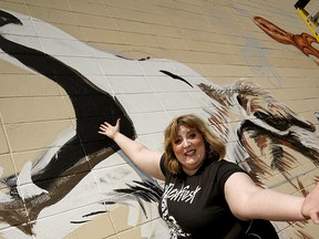 NextFest 2019 festival director Ellen Chorley in front of a mural painted by artists Colleen Ulliac and Deanne Lee at the Nextfest media kickoff in Old Strathcona on Wednesday May 29, 2019. The arts festival will take place May 30 to June 9, 2019. (PHOTO BY LARRY WONG/POSTMEDIA)