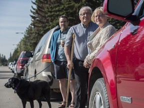 Laurier Heights neighbourhood residents Sam Cooper, left, Philippe Lefebvre and Trudy Hamilton took action after employees of Canterbury Court began parking on their side of the residential 141 Street.