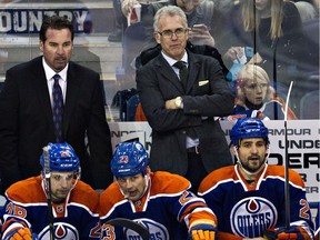Edmonton Oilers head coach Todd Nelson, left, and general manager Craig MacTavish, right, run the bench during a game against the Dallas Stars at Rexall Place in this file photo from Dec. 21, 2014.