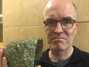 University of Alberta diamond expert Professor Thomas Stachel holds a lherzolitic rock formation.