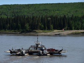 The La Crete ferry crosses the Peace River on May 25. Southwest movement of the Chuckegg Creek wildfire prompted the evacuation Wednesday of the La Crete Ferry Campground.