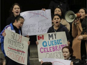 CEGEP and university students protest against Bill 21 outside the Quebec immigration office on Notre Dame St. Friday, April 12, 2019 in Montreal. Bill 21 would impose a ban on public employees in positions of authority  from wearing symbols of faith. These would include police officers, teachers and judges.