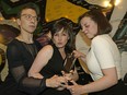 Actors Melissa Thingelstad (left) and Bella King (right) try to grab the Sterling Award from awards organizer Kendra Connor (middle) at the 2019 Elizabeth Sterling Haynes Award nominations.