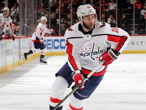 NEWARK, NEW JERSEY - MARCH 19: Brett Connolly #10 of the Washington Capitals takes the puck in the first period against the New Jersey Devils at Prudential Center on March 19, 2019 in Newark, New Jersey.