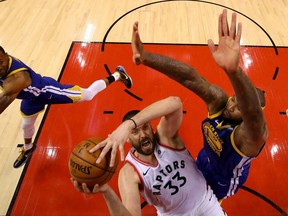 Marc Gasol #33 of the Toronto Raptors attempts a shot against DeMarcus Cousins #0 of the Golden State Warriors during Game Five of the 2019 NBA Finals at Scotiabank Arena on June 10, 2019 in Toronto, Canada.