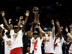 Kawhi Leonard #2 of the Toronto Raptors celebrates with the Larry O'Brien Championship Trophy after his team defeated the Golden State Warriors to win Game Six of the 2019 NBA Finals at ORACLE Arena on June 13, 2019 in Oakland, California.