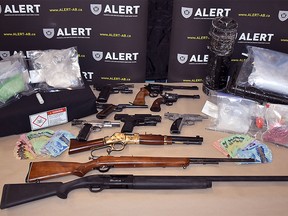 An investigation between ALERT and Peace River RCMP has resulted in the seizure of 12 firearms, body armour, and roughly $200,000 worth of drugs, including fentanyl, cocaine, and methamphetamine. Image supplied