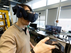 Brendan Concannon, Faculty of Rehabilitation Medicine master student, demonstrates a virtual reality setup that simulates mock patient interviews that are normally played by an actor during the students' Objective Structured Clinical Exam at the University of Alberta in Edmonton, on Friday, June 14, 2019. Students have the opportunity to practice the interview process in a simulated space. Photo by Ian Kucerak/Postmedia