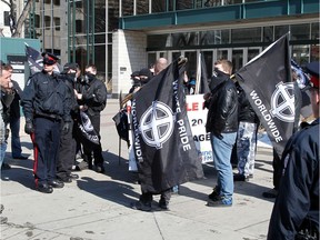 A white-supremacist group is held back by police at 99 St. and 102 Ave. Photo taken in Edmonton, Alberta on March 24, 2012.