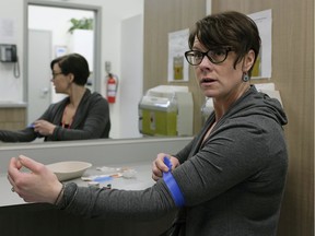 Katrina Stephenson, the staff nurse at the Boyle Street Community Services Supervised Consumption Site, demonstrates the procedure that clinic users will go through when using the site. File photo.