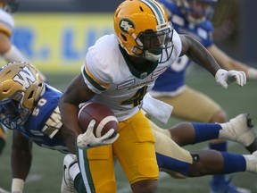 Edmonton Eskimos receiver Tevaun Smith (4) runs with the ball against the Winnipeg Blue Bombers in Winnipeg on Friday, May 31, 2019.