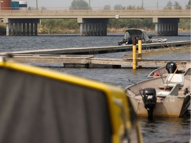 Boats are seen in a branch of the Athabasca River as a wildfire evuacation alert continues in the town of Slave Lake, on Saturday, June 1, 2019.