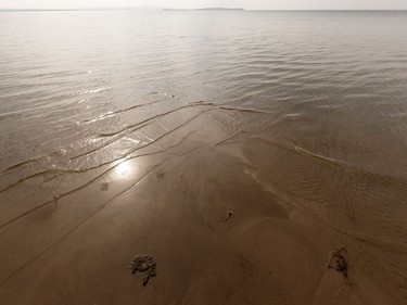 Devonshire Beach is seen as a storm rolls during a wildfire evacuation alert continues in the town of Slave Lake, on Saturday, June 1, 2019.