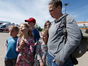 High Level evacuees Crystal Genier and her five kids are celebrating the Monday return to the evacuated town on  outside of an evacuation centre in the town of Slave Lake, on Sunday, June 2, 2019. Photo by Ian Kucerak/Postmedia