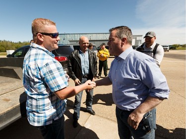 Premier Jason Kenney (right) meets Slave Lake Mayor Tyler Warman at Slave Lake Airport during a tour of fire effected areas on Sunday, June 2, 2019. Photo by Ian Kucerak/Postmedia