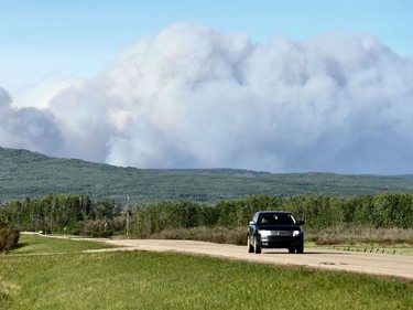 The McMillan Complex wildfires are seen burning from the highway outside Slave Lake, Alberta on Sunday, June 2, 2019. Photo by Ian Kucerak