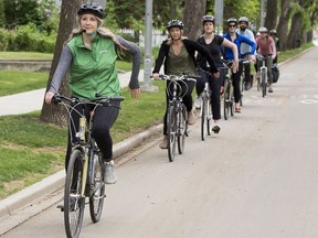 Krista Zerbin leads a group of cyclists down 83 Avenue near 106 Street on a bike ride hosted by the City of Edmonton's Bike Street Team on Wednesday, June 5, 2019, in Edmonton.  Saturdays from June 1 - September 28, the City of Edmonton Bike Street Team will offer free guided bike ride alongs of Edmonton's southside and downtown protected bike routes. The ride alongs will depart the Old Strathcona Farmers' Market at 10 a.m. This is one of the city's Vision Zero initiatives to help people drive, bike and walk around Edmonton safely.