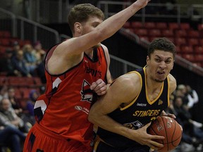 Edmonton Stingers Brody Clarke (right) drives past Fraser Valley Bandits Dallin Bachynski (left) during Canadian Elite Basketball League game action in Edmonton on Friday June 7, 2019.