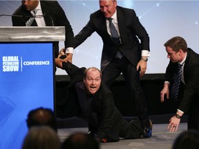 A protester disrupted the opening of the Global Petroleum Show in Calgary as Premier Jason Kenney was walking onto the stage on Tuesday, June 11, 2019.