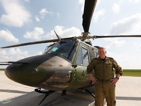 Lt.-Col. Chris Morrison, commander of 408 Tactical Helicopter Squadron, is seen with a CH-146 Griffon on the apron at CFB Edmonton on Friday, June 14, 2019. The unit has served in Mali, Iraq and Afghanistan most recently as well as domestic and foreign missions throughout the modern era. The unit was first formed in as 408 (Bomber) Squadron on June 15, 1941, and served in the Second World War.