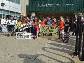 Some parents with their children at A. Blair McPherson School are angry the public school district has proposed removing junior high grades from that school and moving them to another new school in 2020.