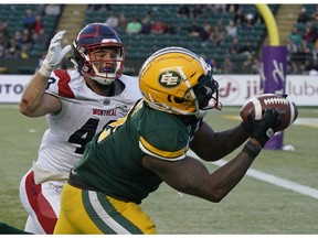 Edmonton Eskimos C.J. Gable eludes a tackle by Montreal Alouettes Jean-Gabriel Poulin to make a touchdown reception during CFL game action at Commonwealth Stadium in Edmonton on Friday June 14, 2019.