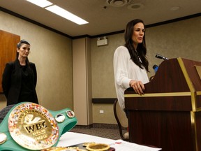 World champion boxer Jelena Mrdjenovich is seen with her belts during a KO Boxing press conference at the Chateau Lacombe Hotel in Edmonton, on Thursday, June 20, 2019. She's facing Italy's Vissia Trovato in the WBC & WBA World Featherweight Title Main Event at KO 86 on June 22. Photo by Ian Kucerak/Postmedia