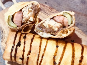 The Snickle Dog ó featuring a Snickers bar, hot dog and a pickle wrapped in a tortilla and deep fried, is one of a number of new foods coming to K-Days in Edmonton this year. Submitted