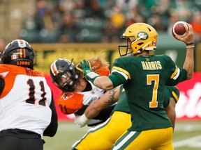 Edmonton Eskimos' quarterback Trevor Harris (7) throws in the pocket as BC Lions' Odell Willis (11) races in during a CFL football game at Commonwealth Stadium in Edmonton, on Friday, June 21, 2019. Photo by Ian Kucerak/Postmedia