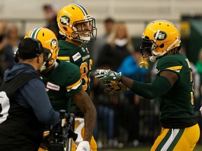 Edmonton Eskimos' Greg Ellingson (82) celebrates a touchdown with Natey Adjei (3) on the BC Lions during a CFL football game at Commonwealth Stadium in Edmonton, on Friday, June 21, 2019. Photo by Ian Kucerak/Postmedia