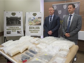 ALET CEO Chad Coles, left, and RCMP Staff Sgt. Carson Creaser answers questions related to a two-year investigation by ALERT that has cut off a drug pipeline between B.C. and Alberta. More than $2 million in drugs and cash was seized and a dozen suspects have been arrested on Wednesday, June 12, 2019.