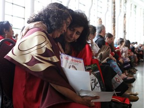 Women embrace during the closing ceremony of the National Inquiry into Missing and Murdered Indigenous Women and Girls in Gatineau, Quebec, Canada, June 3, 2019.